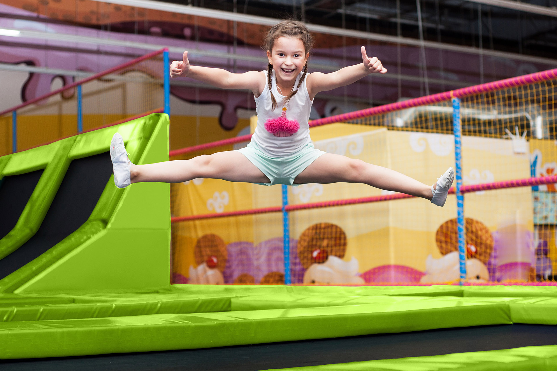 Little girl jumping on a trampoline